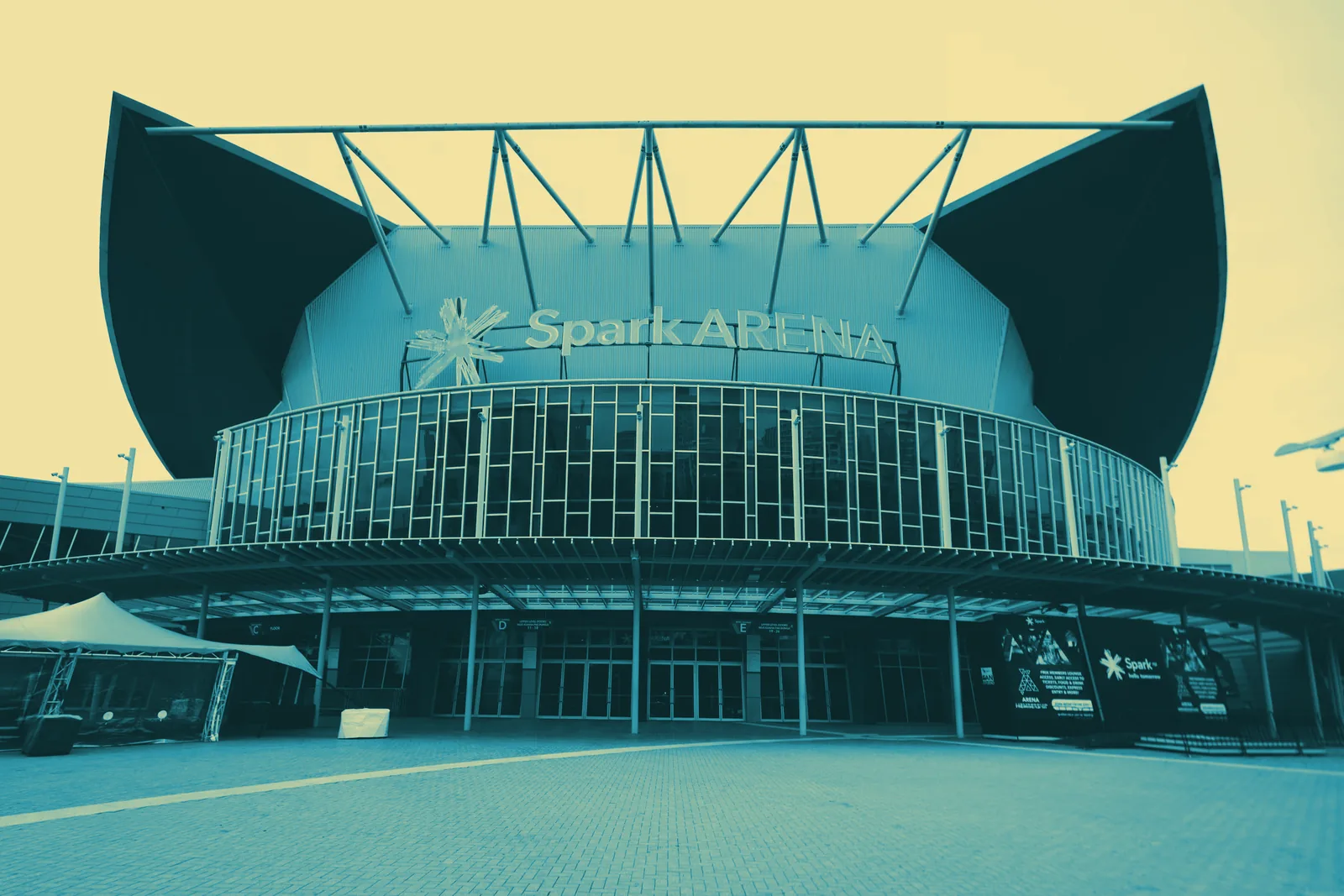 Spark Arena, Auckland, rendered in the conference’s teal-and-cream duotone